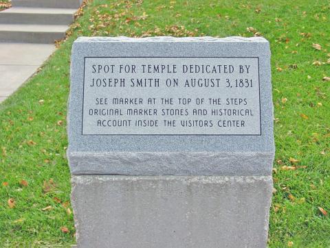 Marker identifying the temple lot dedicated by the Prophet Joseph Smith in-between receiving sections 58 and 59. Taken in 2001.